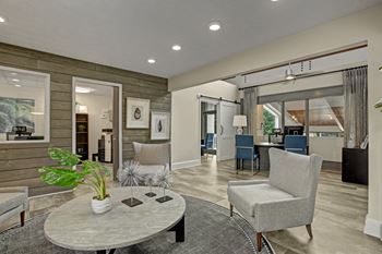 A living room with a grey sofa and a grey coffee table.